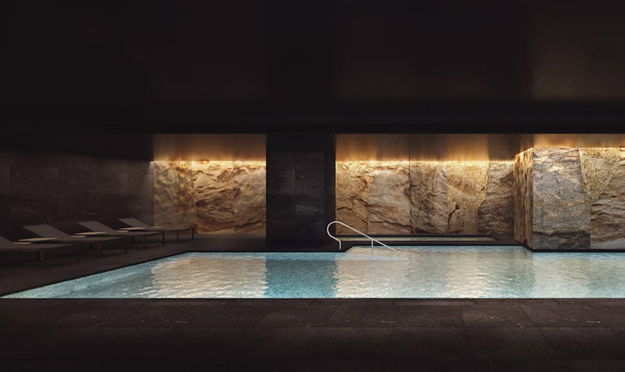 Περιτριγυρισμένο από τεράστιους ογκόλιθους που προέρχονται από το νησί Shikoku, η κομψή υπόγεια πισίνα σπα μοιάζει με μια απομονωμένη σπηλιά